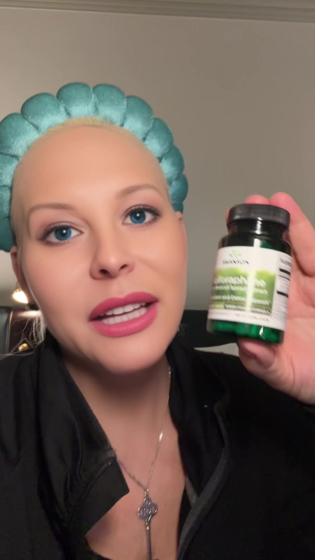 Jamielee holding Swanson Sulforaphane from Broccoli Sprout Extract