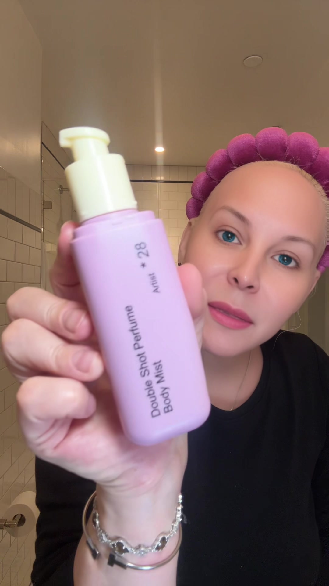 Jamielee holding HETRAS Perfume Moisturizing Artist Body Mist +28