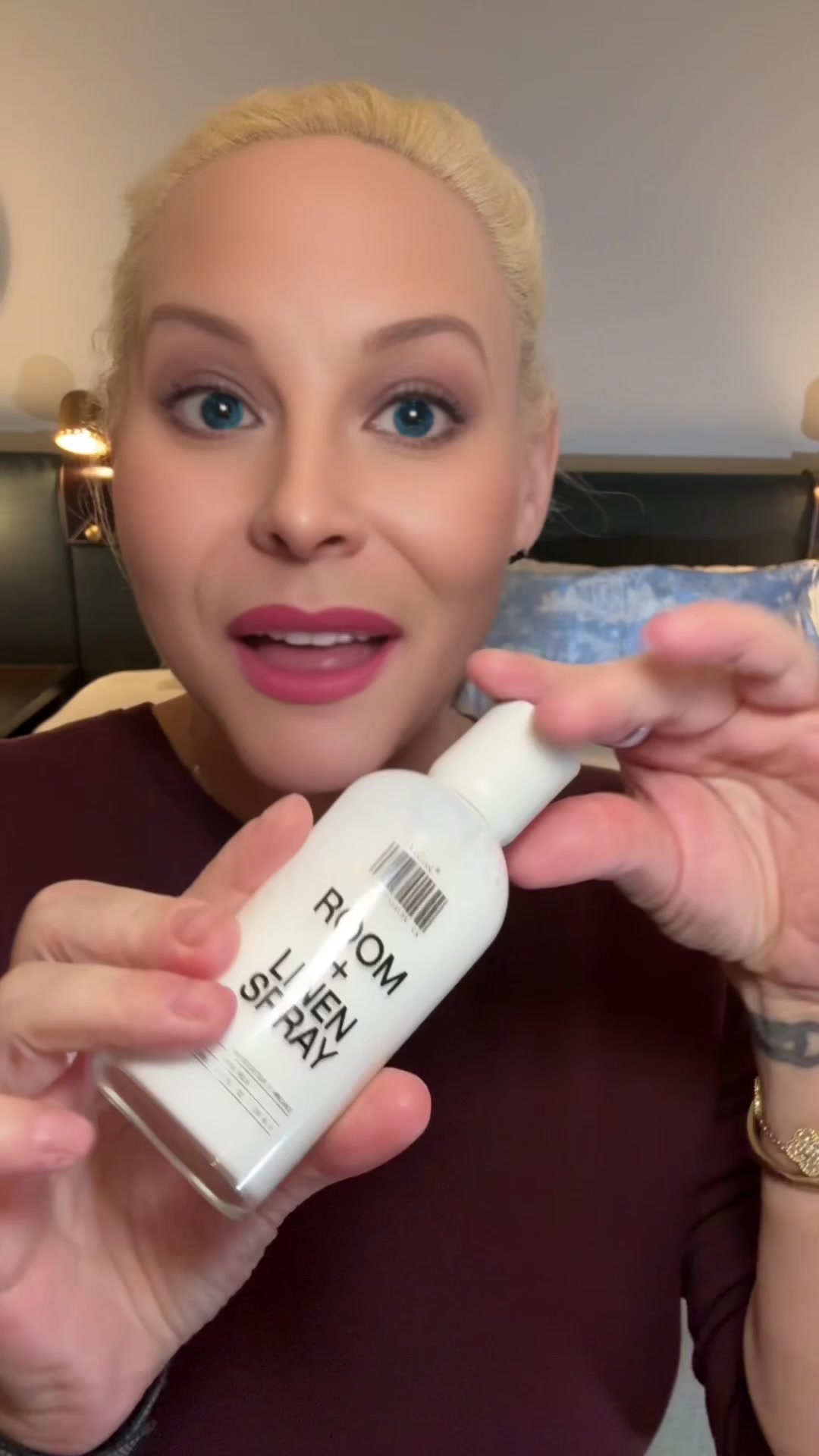 Jamielee holding DedCool Xtra Milk Room and Linen Spray